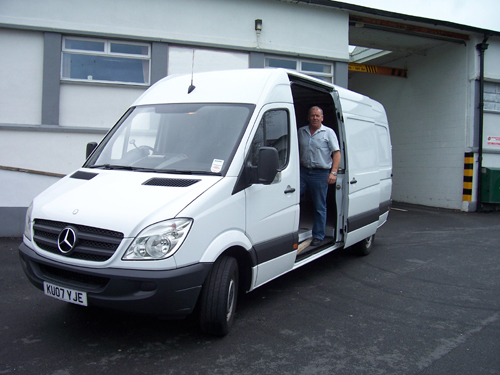 Peter Slater proprietor of PLS Couriers preparing to load near Kendal Cumbria